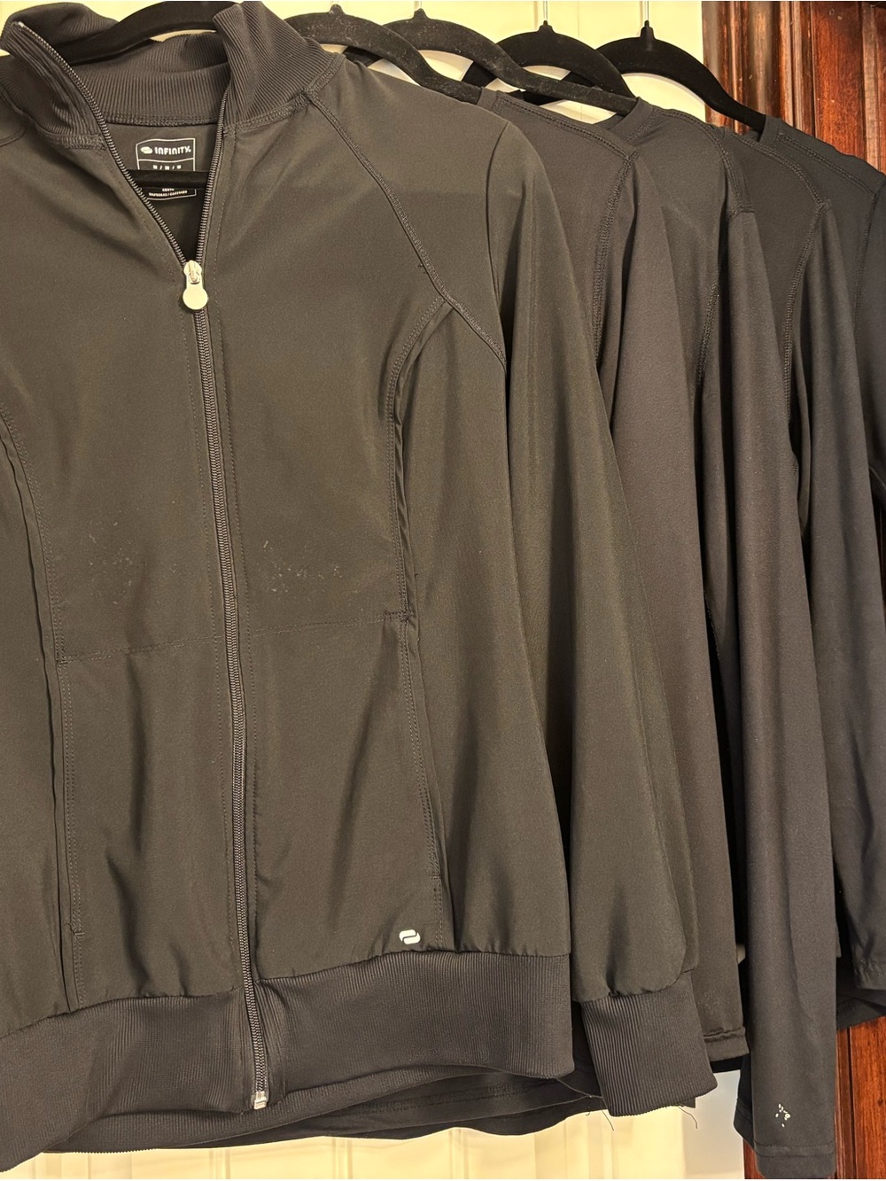 Scrub jacket and 4 under scrub tops. Sz M